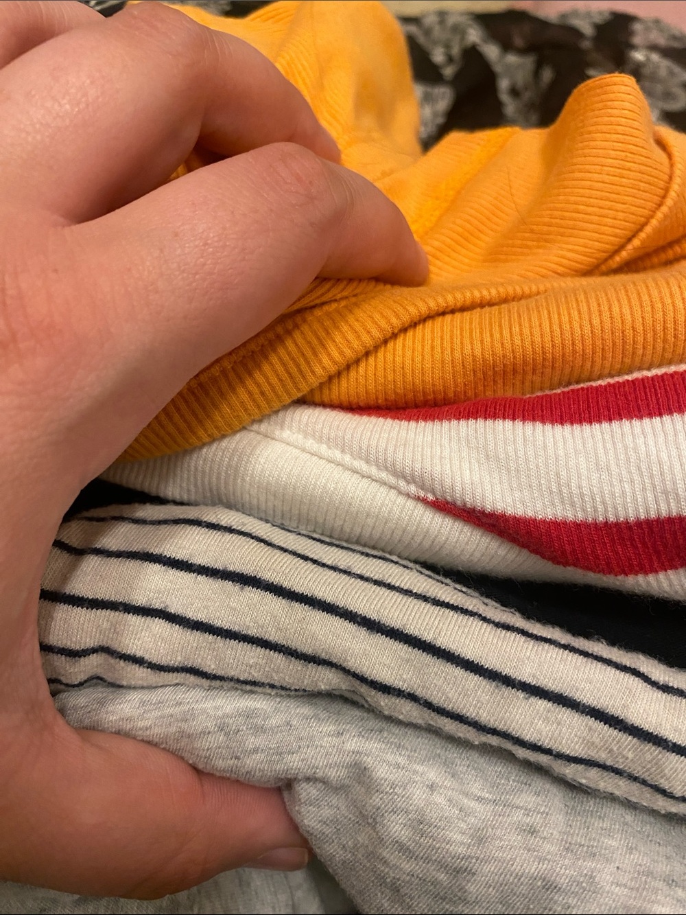 Stack of Casual Tops in Mustard, Red-White Stripe, Navy Stripe, and Light Gray